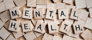 Wood tiles with 'mental healthcare' written on them