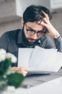 Caucasian male Stressed over payroll