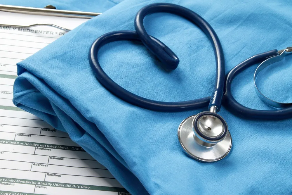 Medical professional uniform folded and organized.
